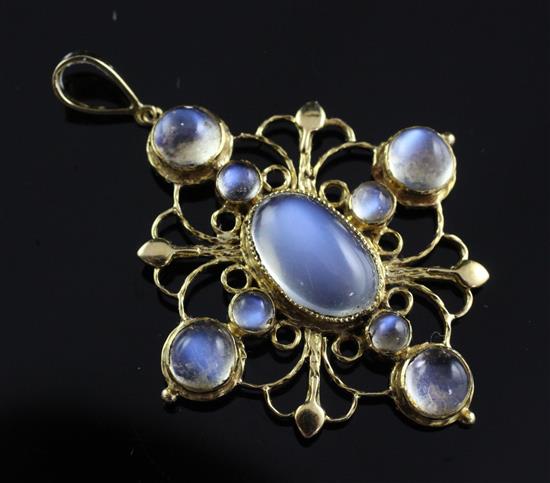 An early to mid 20th century 15ct and moonstone cruciform pendant, 1.75in incl. bale.